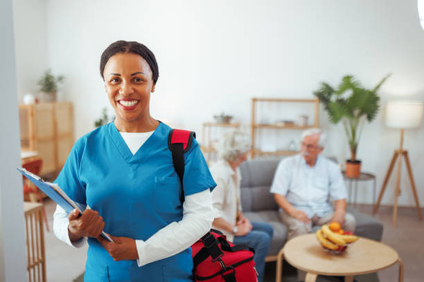 istock Smiling female nurse posing for a shot during home visit 2175665787