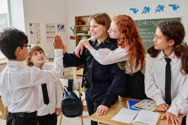 istock Police Officer And Teenagers Having Fun During Class 2175667220