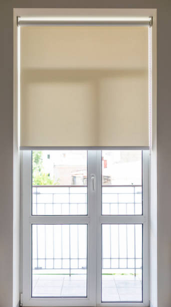 istock Roller blind with chain mechanism close-up on a balcony door 2175667909