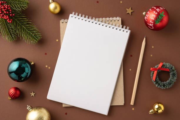 istock A blank notebook surrounded by festive Christmas decorations, perfect for holiday planning and new year resolutions in a cozy holiday setting 2175669884