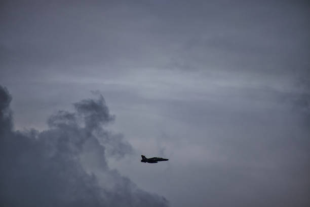 istock Advanced trainer jet against moody grey sky 2175670734