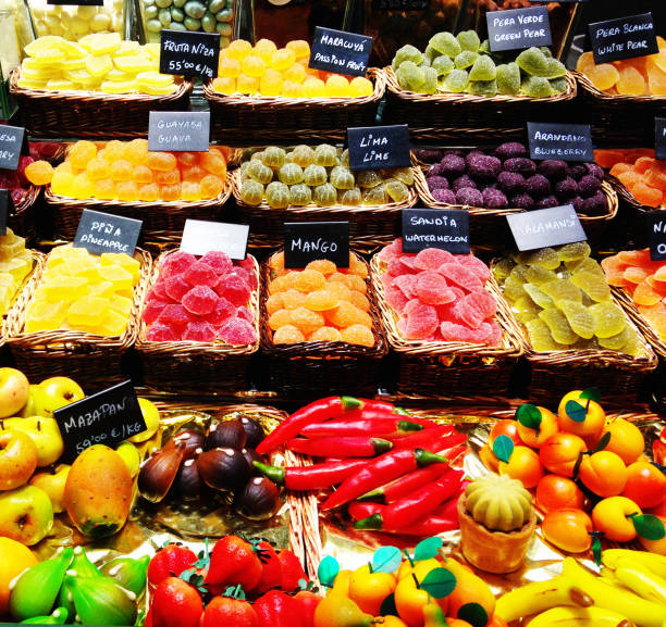 Colorful marzipan or almond paste fruit shaped candy at the Colmar Christmas Market in Alsace, France