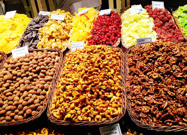 istock Nuts and dried fruit in baskets at a market in Spain 2175673345