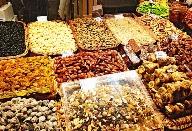 istock Dried fruit and nuts in baskets in a market in Spain 2175673469