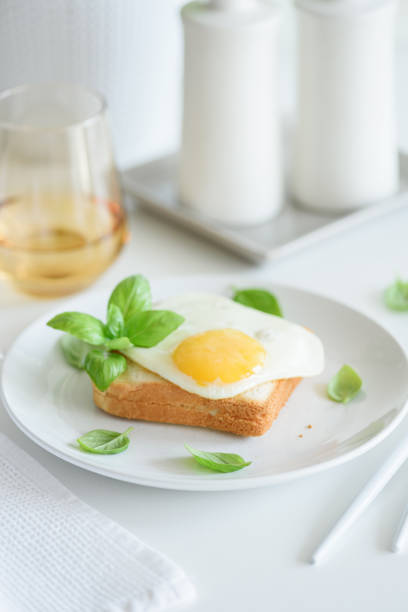 Cooking sunny side up eggs on pan