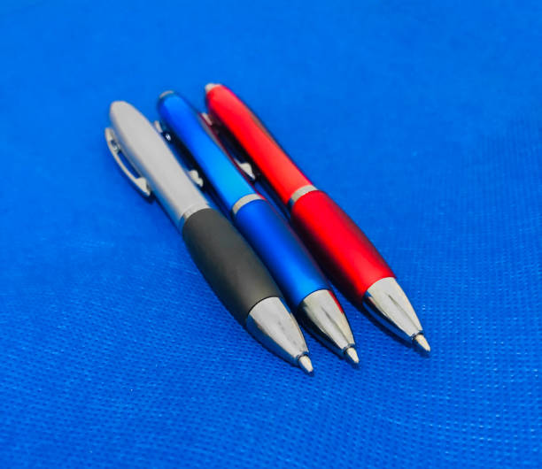 istock Three pens, red, blue and the last gray. All three are in a horizontal position 2175676379