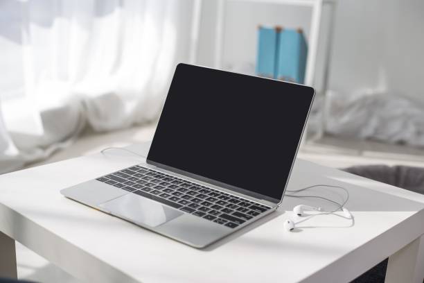 Minimalistic workspace with laptop and earphones
