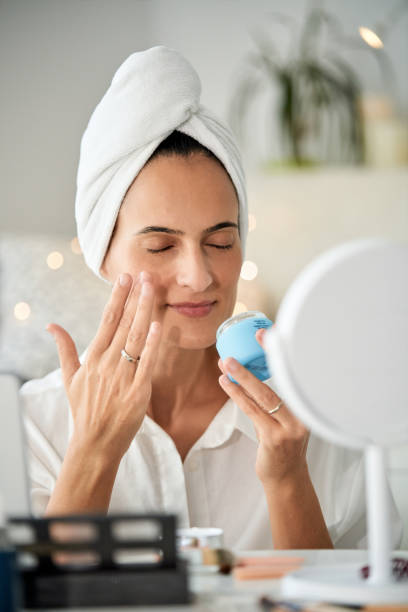 istock Relaxed woman with closed eyes applying smoothing face cream 2175679754