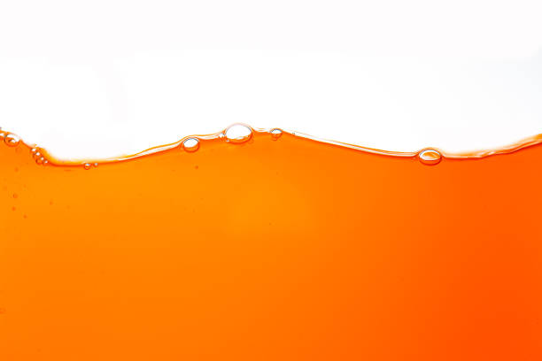 istock Orange juice texture isolated on white background,Close up bright orange juice texture for health and nature waves 2175681923