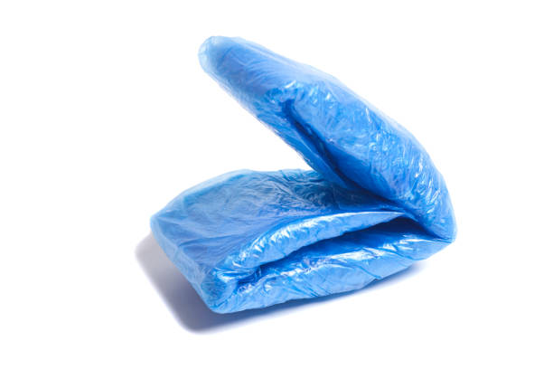bundles of blue shoe covers isolated on white background.