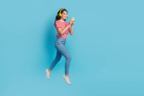 istock Full length photo of positive lady addicted user moving empty space typing chatting modern device isolated on blue color background 2175682787