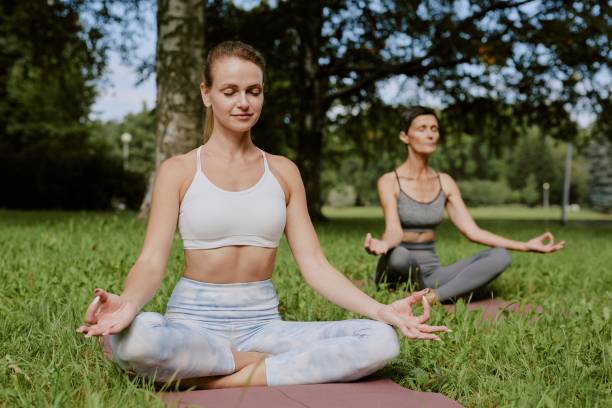 istock Mom and Daughter Mediating in Park 2175684907
