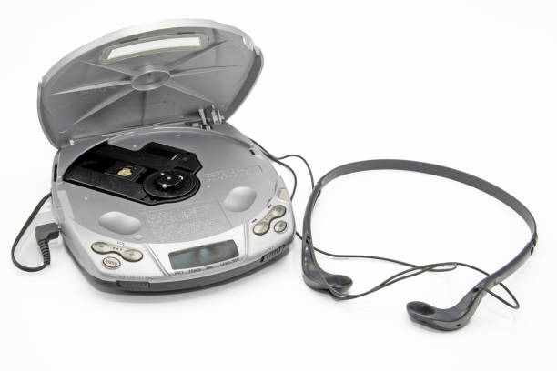 discman with open lid without disc and with headphones isolated on white background discman with open lid without disc and with headphones isolated on white background open cd player stock pictures, royalty-free photos & images