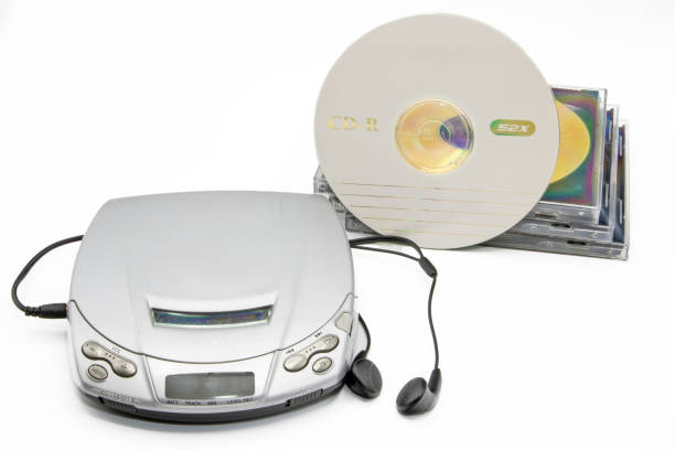 istock Close-up of a discman with cd cases next to it isolated on white background 2175685532
