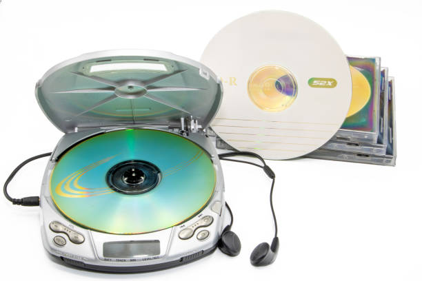 istock Close-up of a discman with cd cases next to it isolated on white background 2175685550
