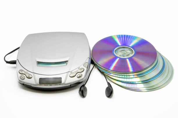 istock Close-up of a discman with a stack of cd's next to it isolated on white background 2175685556