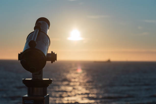 Norddeich,Germany. July 14,2025.Public telescope on the dike in Norddeich, overlooking the wide-open kite meadow.Offering scenic views and a peaceful North Sea experience in East Frisia