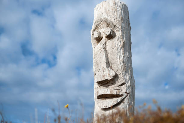Beautiful wooden sculpture on blue sky background