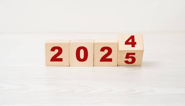 istock Transition from 2024 to 2025 Using Wooden Block Numbers on Minimalist White Background 2175686873
