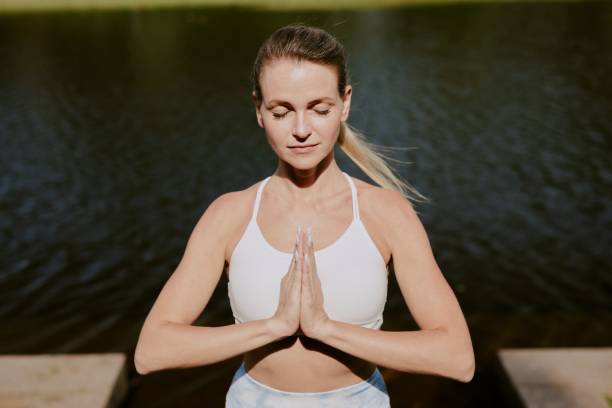 istock Woman Meditating in Yoga Pose 2175687113
