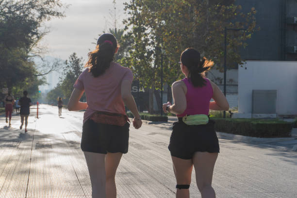 istock Two Latina women running outdoors in the morning 2175687215