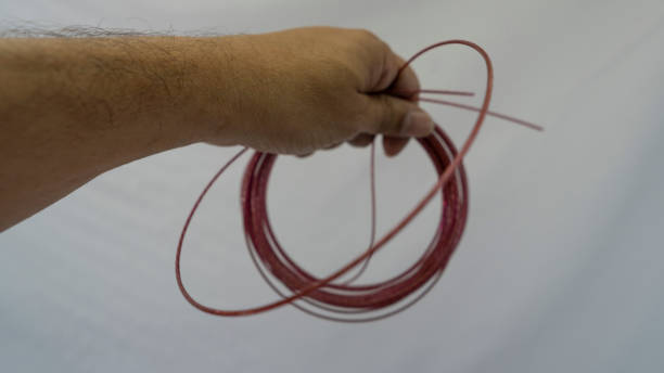 istock Holding thin steel cable for general services in hand 2175688081