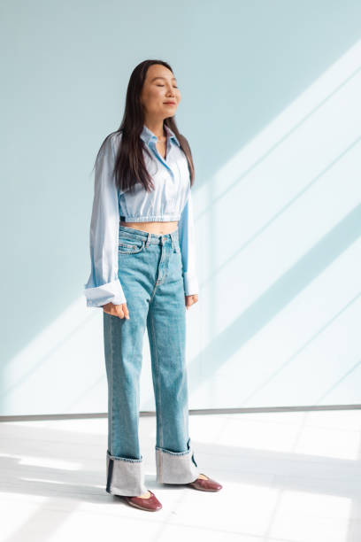 istock Casually dressed woman basking in natural sunlight 2175688283