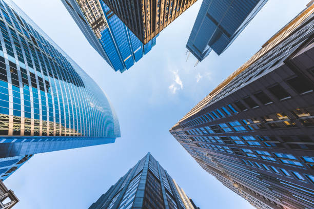 Gazing up at towering modern skyscrapers in chicago, reflecting sunlight and symbolizing success and growth in the financial district
