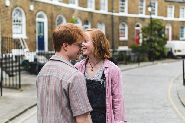istock Young couple smiling and being affectionate on london street 2175689892