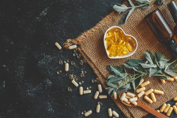 istock Natural vitamins organic on dark background 2175690784
