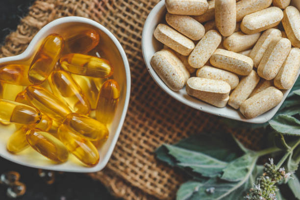 istock Natural vitamins organic on dark background 2175690787