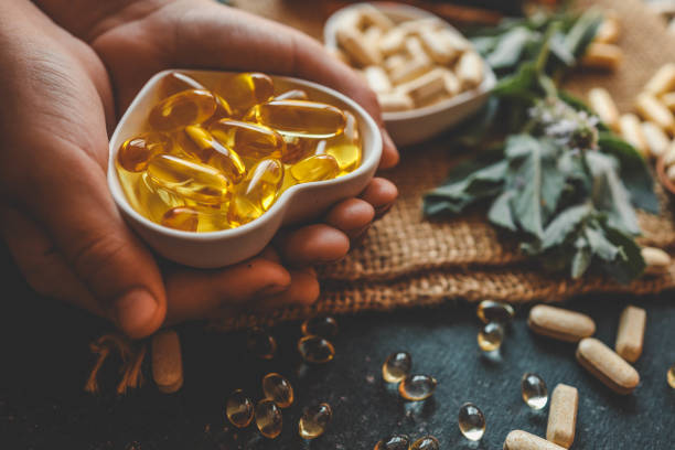 Natural organic vitamins in hands close-up
