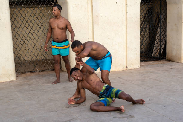 Casablanca, Morocco, 08 11 2024 : Three young men fighting for fun in the street.