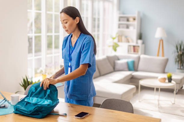 istock Focused nurse organizing backpack in living space. 2175692235