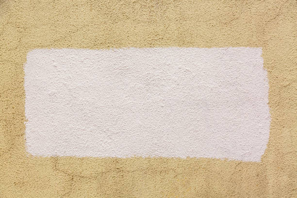 Mockup and template. Yellow painted concrete cement wall background. Wallpaper with Copy Space in white color.
