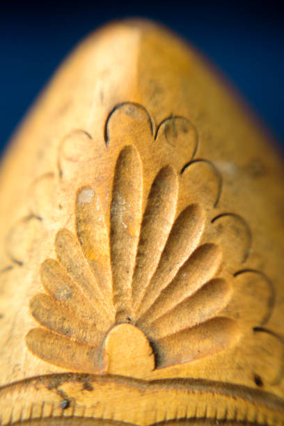 Carved  graphic ornament in wooden clog