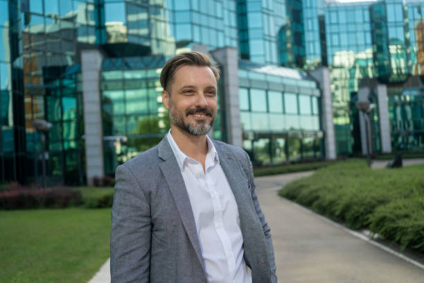 istock Smiling businessman in city 2175698451