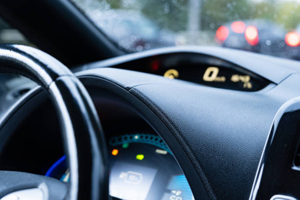 istock The dashboard displays various vehicle functions, including speed and fuel, as the rain obscures visibility while driving through heavy city traffic 2175704085