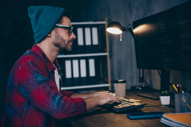 istock Photo of serious confident programmer wear spectacles playing game modern device indoors workplace workshop home 2175705620