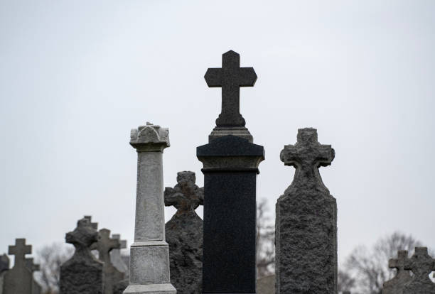 View of a grave stone cross  at St. Tudno's Church, Llandudno, UK