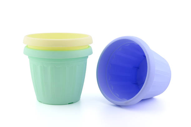 istock multi-colored plastic pots for seedlings and indoor plants and flowers 2175708948
