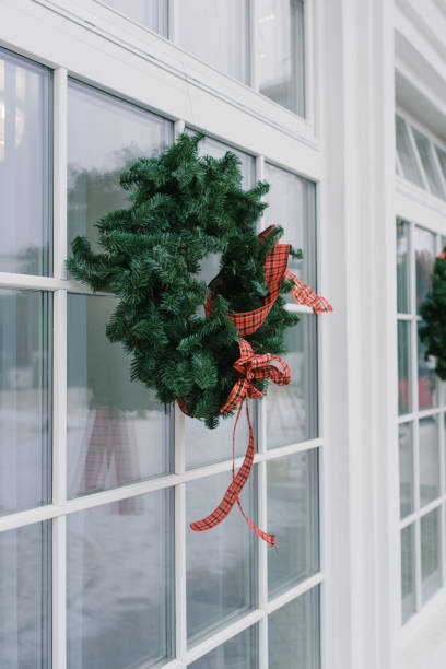 istock Front door with a Christmas wreath and bows. Home decor 2175713423