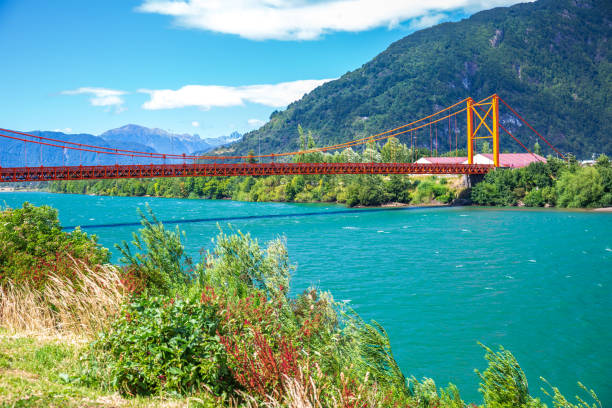 orange bridge over river at Puerto Aysen, Chile