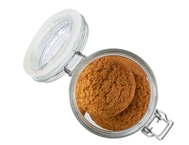 istock Open jar with oatmeal cookies isolated on white background, top view. 2175715158
