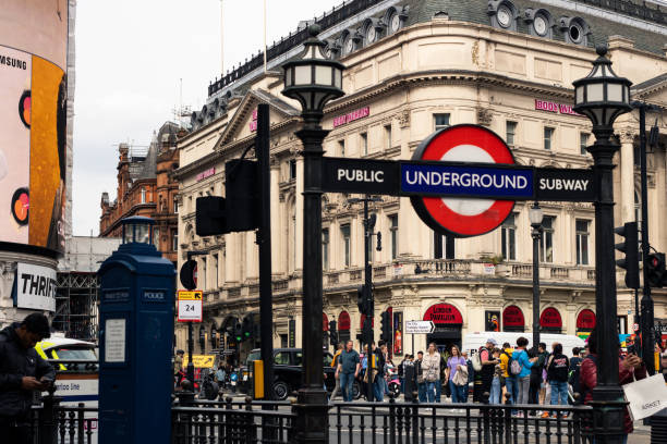 London, England, Apr 30 2023: Piccadilly Circus Underground entrance with people around.