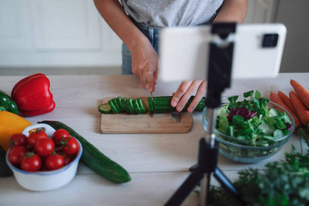 istock Cutting cucumber for healthy salad, filming tutorial video 2175724239