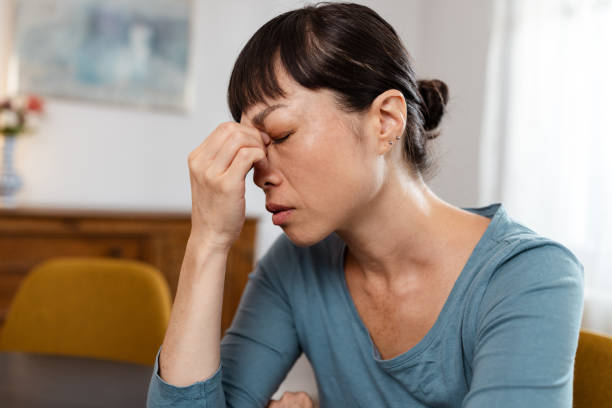 istock Japanese woman feeling depressed and having a headache 2175724721