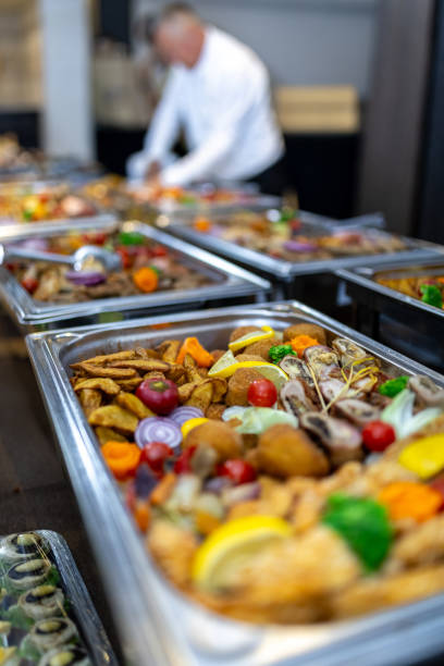 istock Buffet spread featuring assorted dishes and vibrant vegetables at a catered event in a modern venue 2175726413