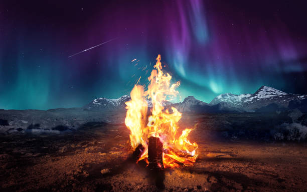 istock Cosy Camp Fire And the Northern Lights Camping Adventure 2175729121