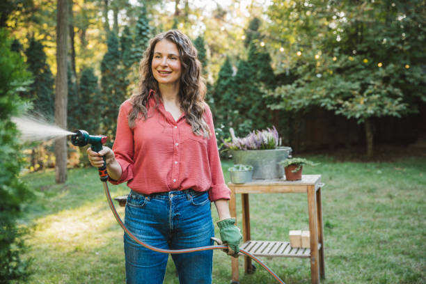 istock Woman gardening in back yard 2175729556